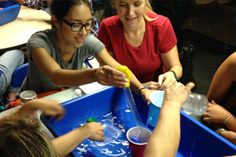 Student instructors participate in open-ended water exploration.